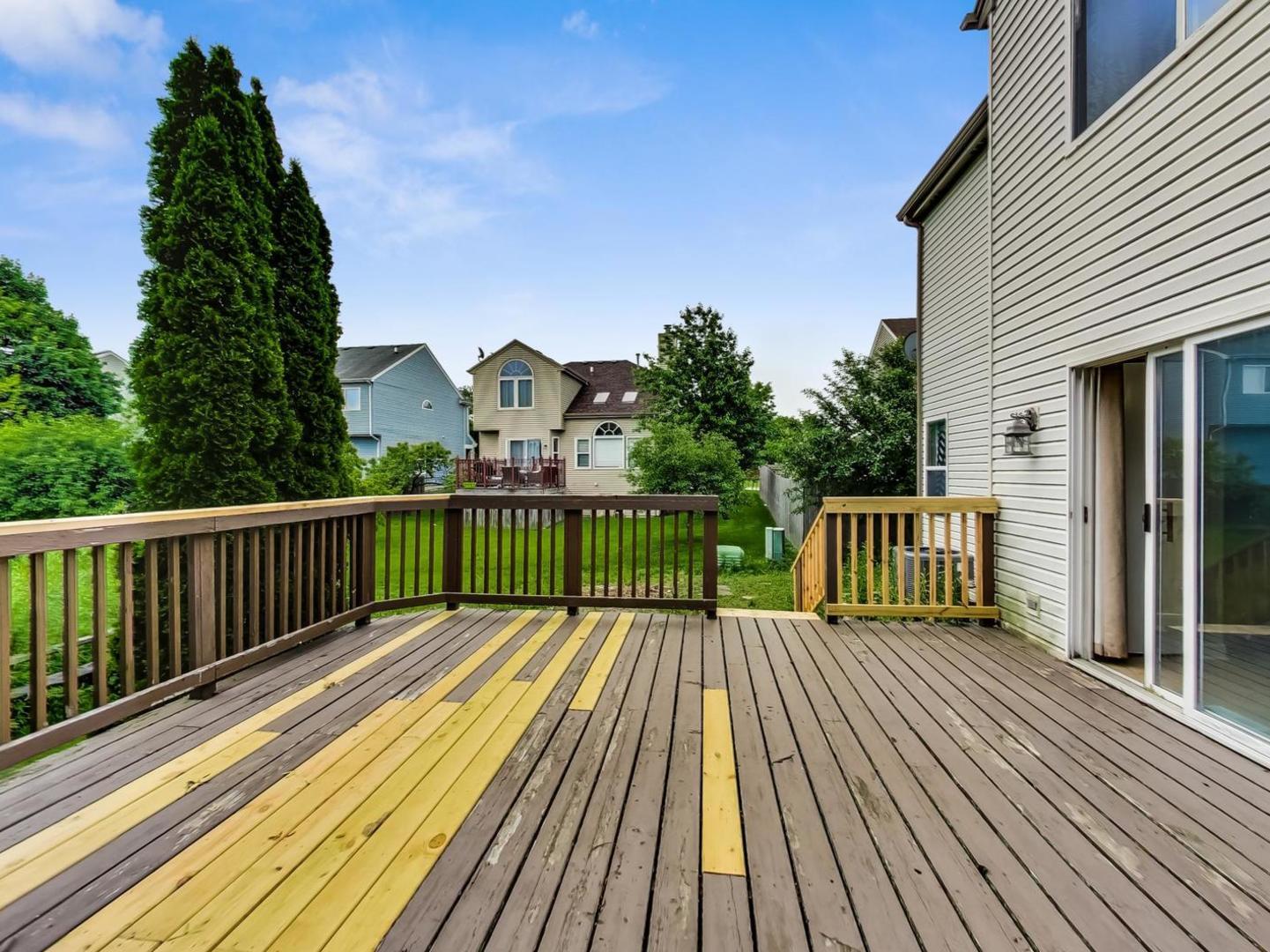 2385 North Periwinkle Way Round Lake Beach, IL 60073 - Photo 41 of 51 a view of balcony with wooden floor & fence