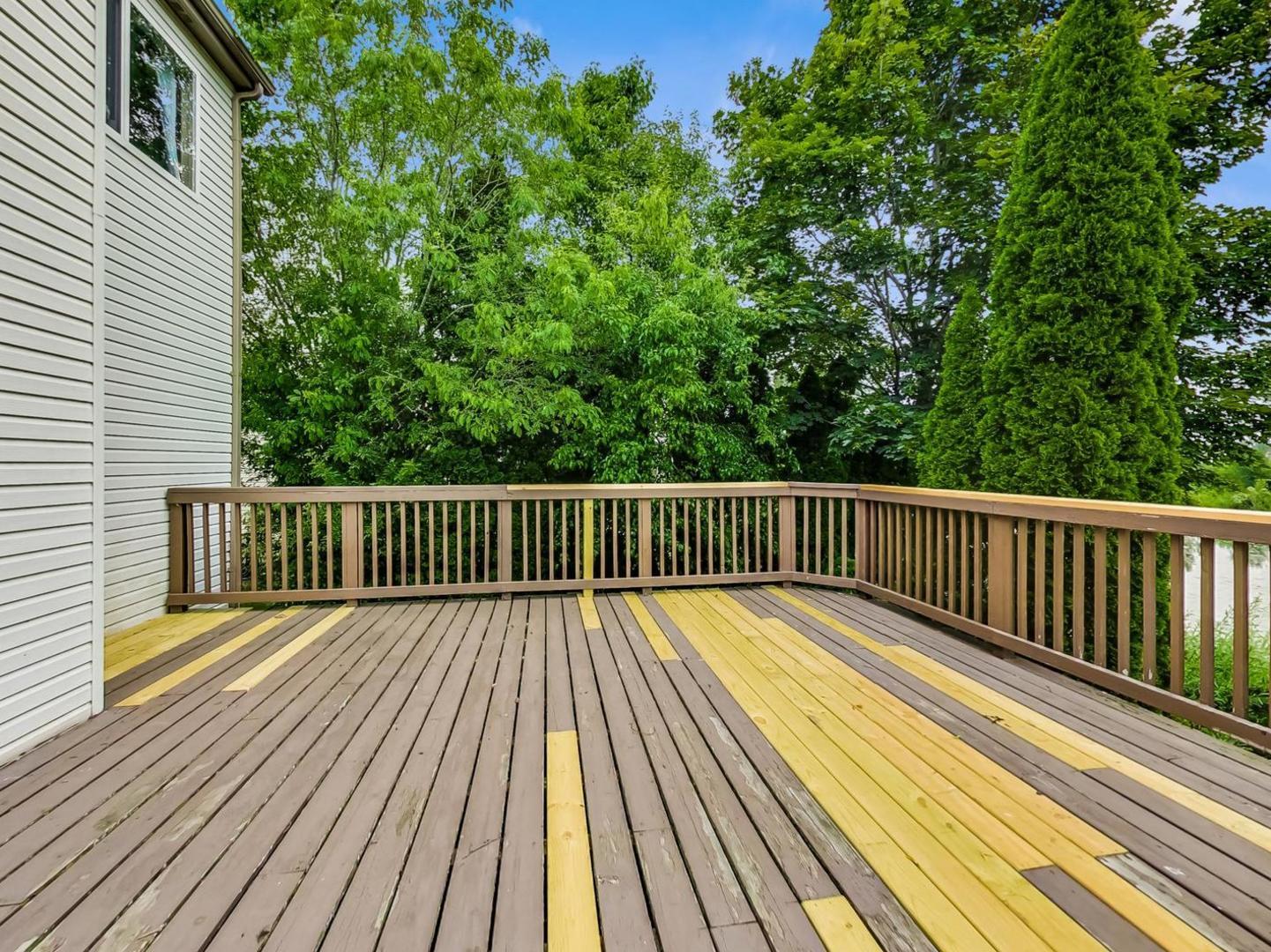 2385 North Periwinkle Way Round Lake Beach, IL 60073 - Photo 42 of 51 a balcony with view of trees in front of it