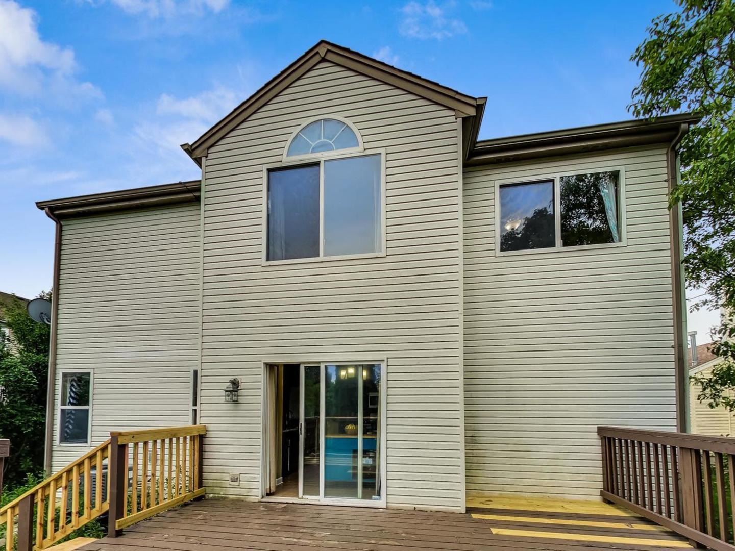 2385 North Periwinkle Way Round Lake Beach, IL 60073 - Photo 45 of 51 a front view of a house with wooden stairs