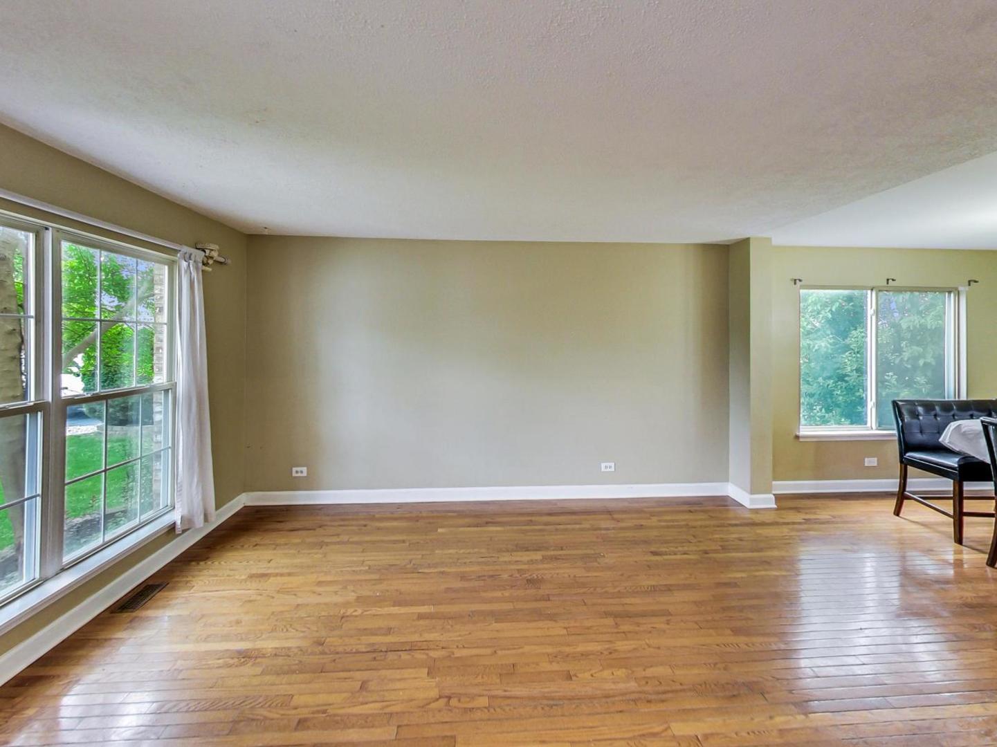 2385 North Periwinkle Way Round Lake Beach, IL 60073 - Photo 8 of 51 a view of room with window and wooden floor