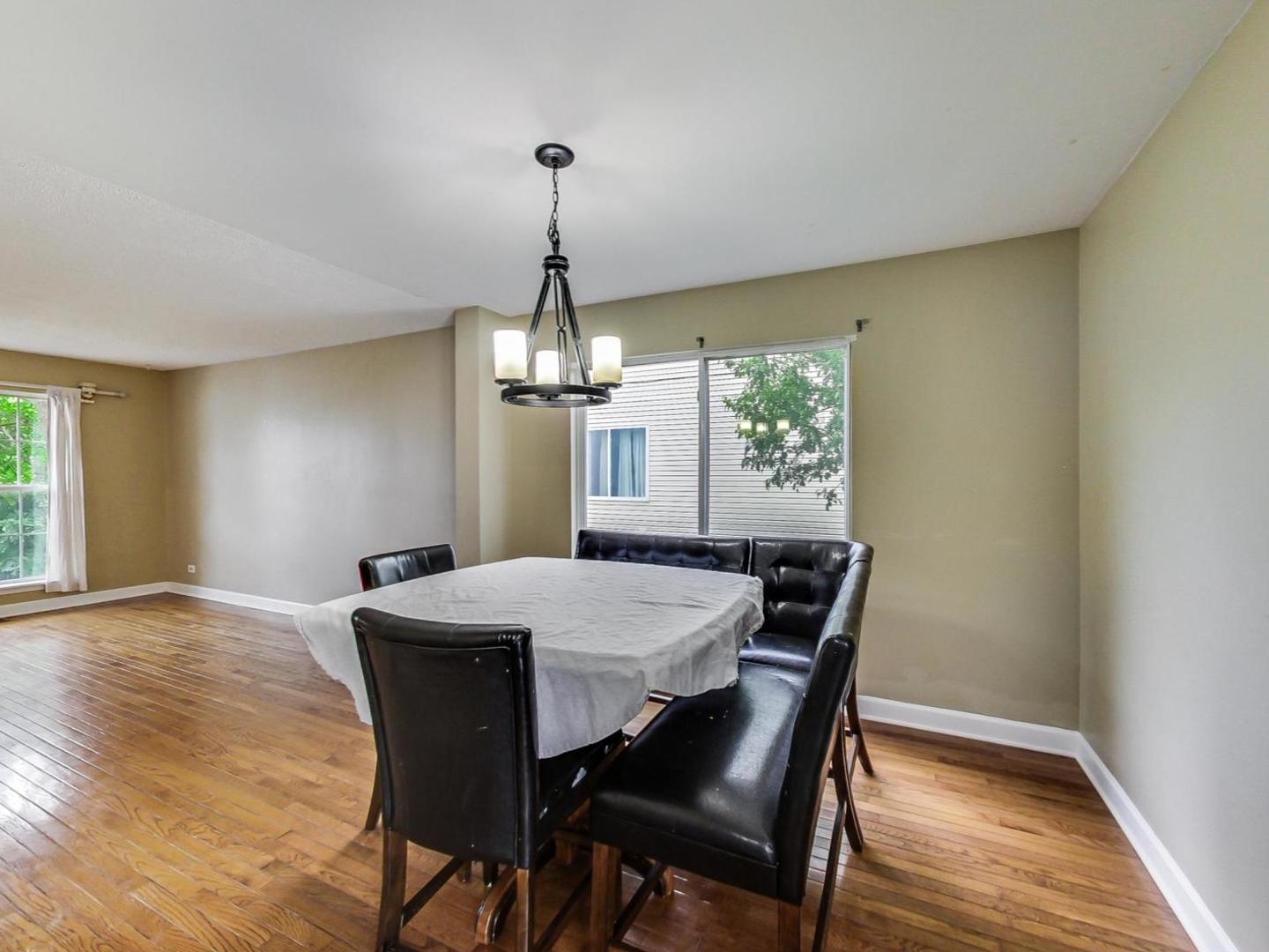 2385 North Periwinkle Way Round Lake Beach, IL 60073 - Photo 10 of 51 a view of a dining room with furniture window and wooden floor