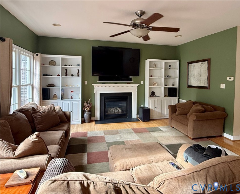 9018 Brigadier Road Mechanicsville, VA 23116 - Photo 7 of 11 Hardwood flooring, gas log fireplace with mantel,