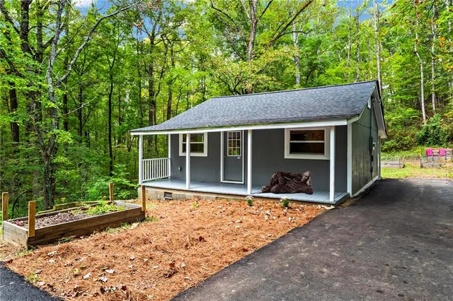 a house with trees in the background