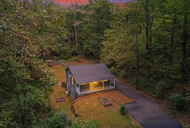 an aerial view of a house with a yard
