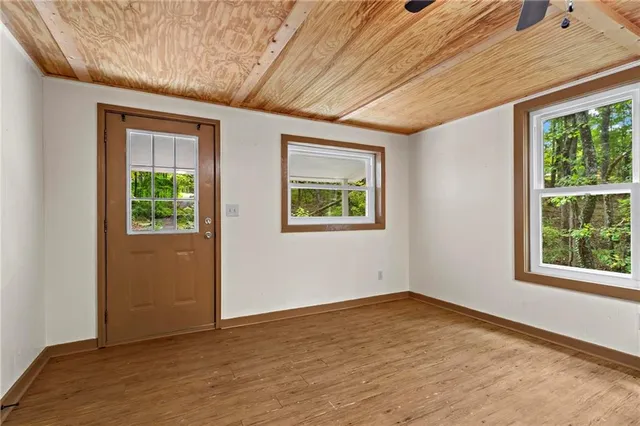 a view of an empty room with a window