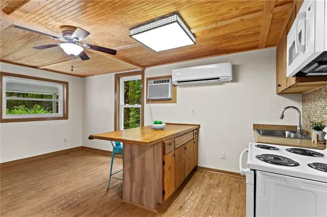 a kitchen with stainless steel appliances granite countertop a stove and a refrigerator
