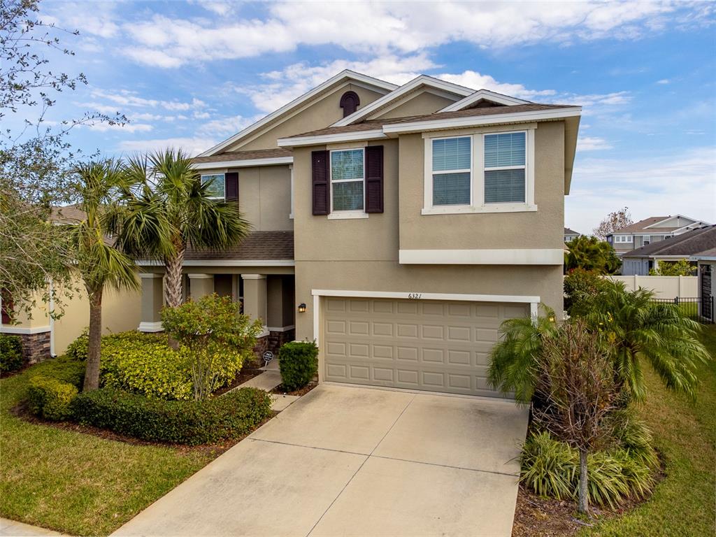 6321 Sunsail Place Apollo Beach, FL 33572 - Photo 1 of 1 a front view of a house with a yard