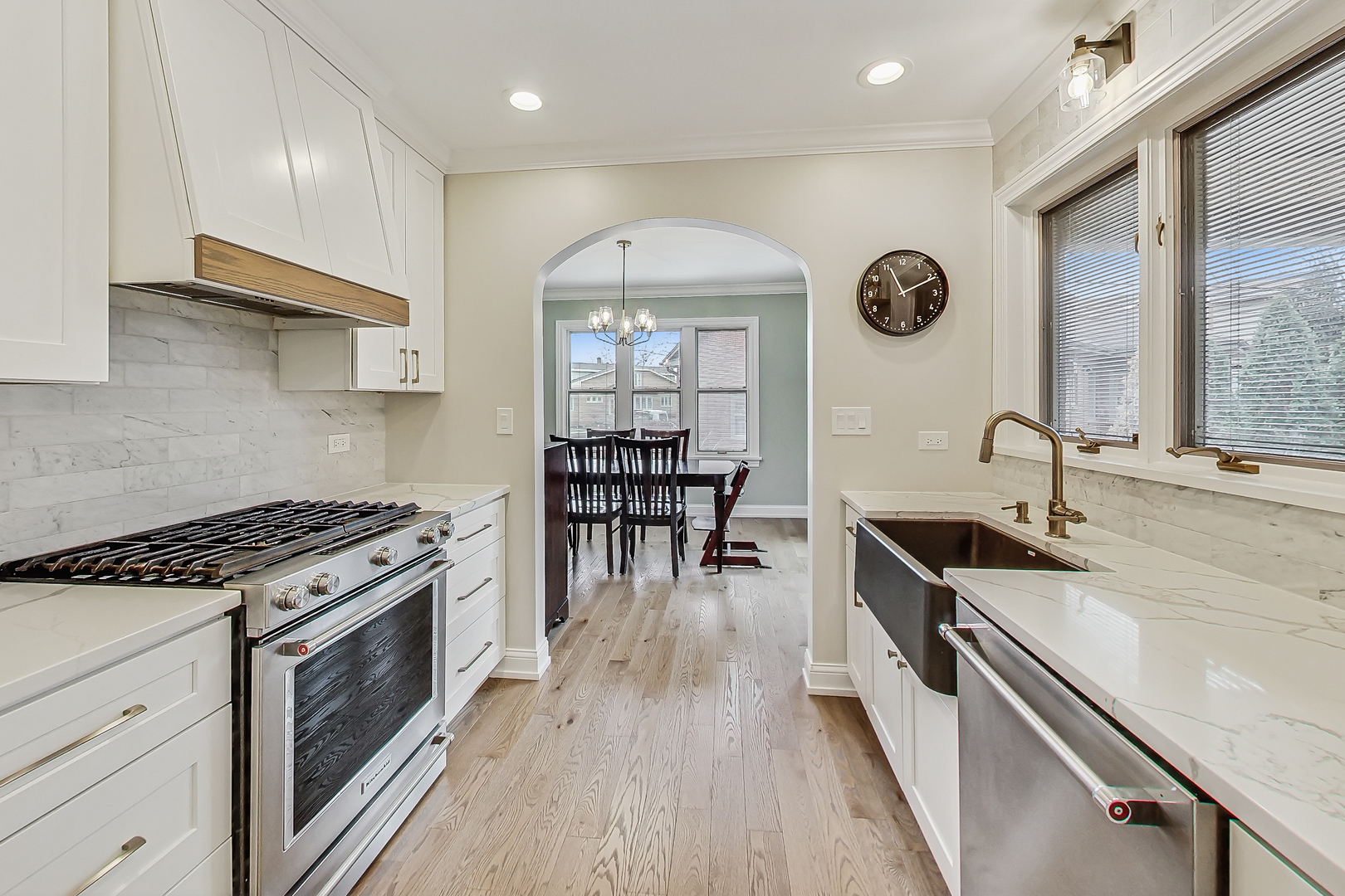 238 South Merrill Street Park Ridge, IL 60068 - Photo 10 of 40 a kitchen with granite countertop a stove a sink and a wooden floors