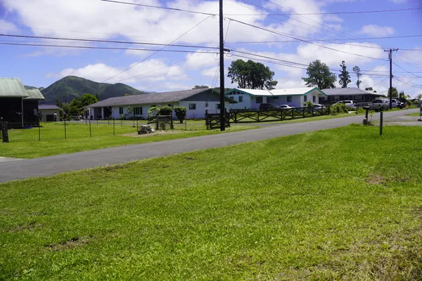 a view of a big yard with a table and chairs