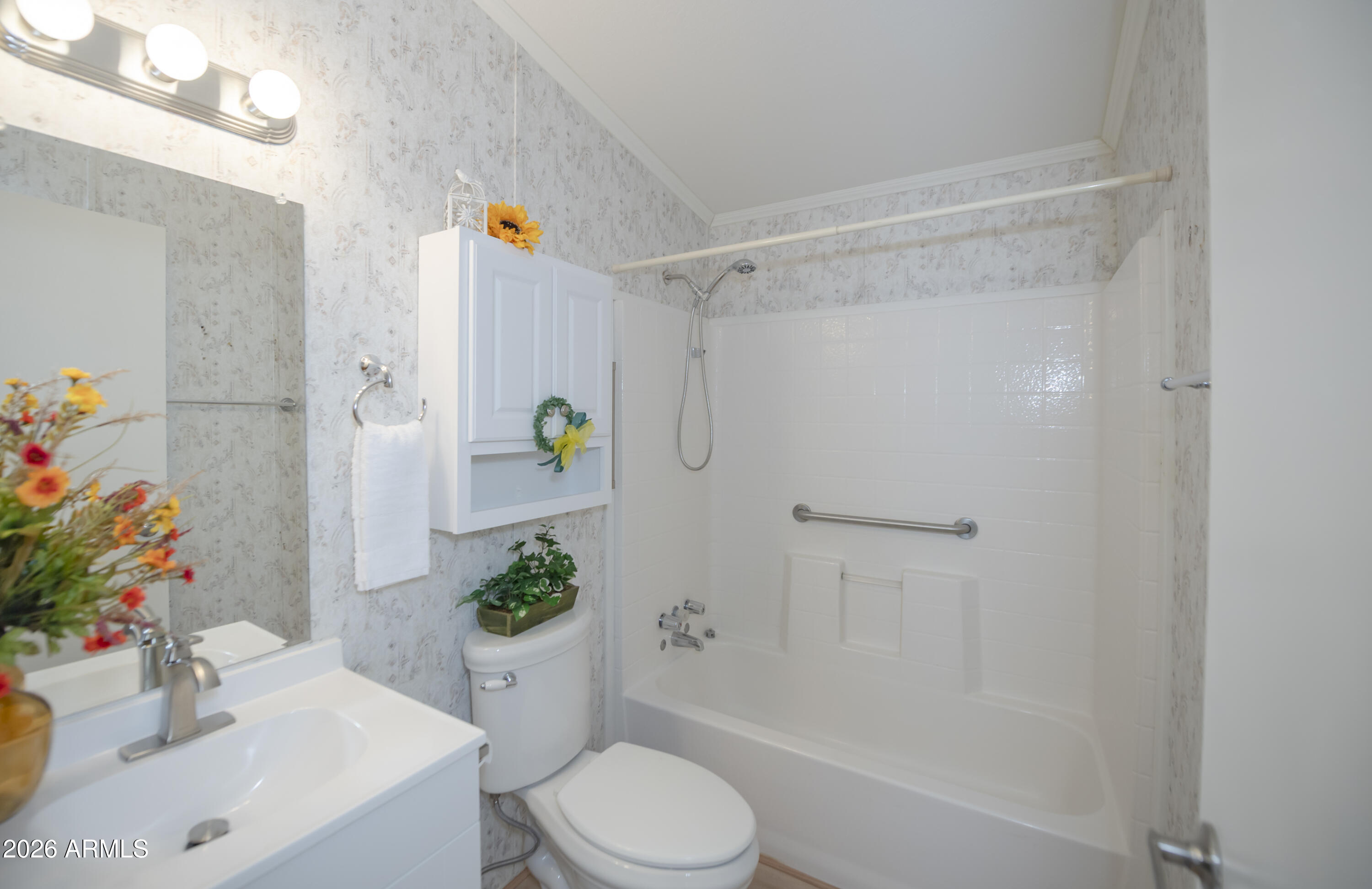 11250 East State Rte 69, Unit 1125 Dewey, AZ 86327 - Photo 26 of 45 a bathroom with a sink mirror vanity and toilet