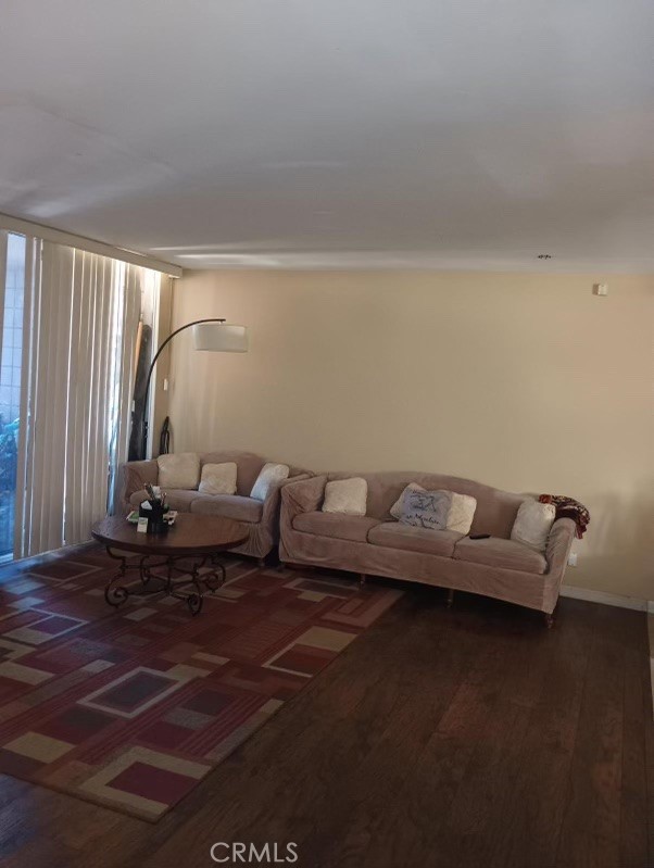 6979 Palm Court, Unit 204A Riverside, CA 92506 - Photo 3 of 6 a living room with couch and a wooden floor