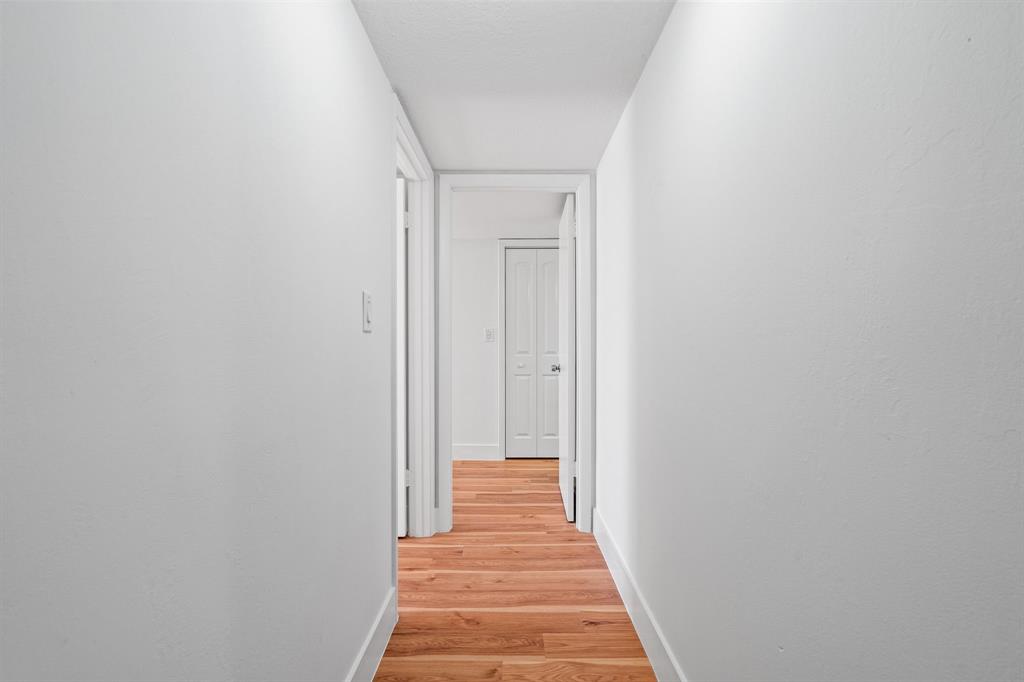 5700 Southwest 127th Avenue, Unit 1304 Miami, FL 33183 - Photo 20 of 42 a view of a hallway with wooden floor