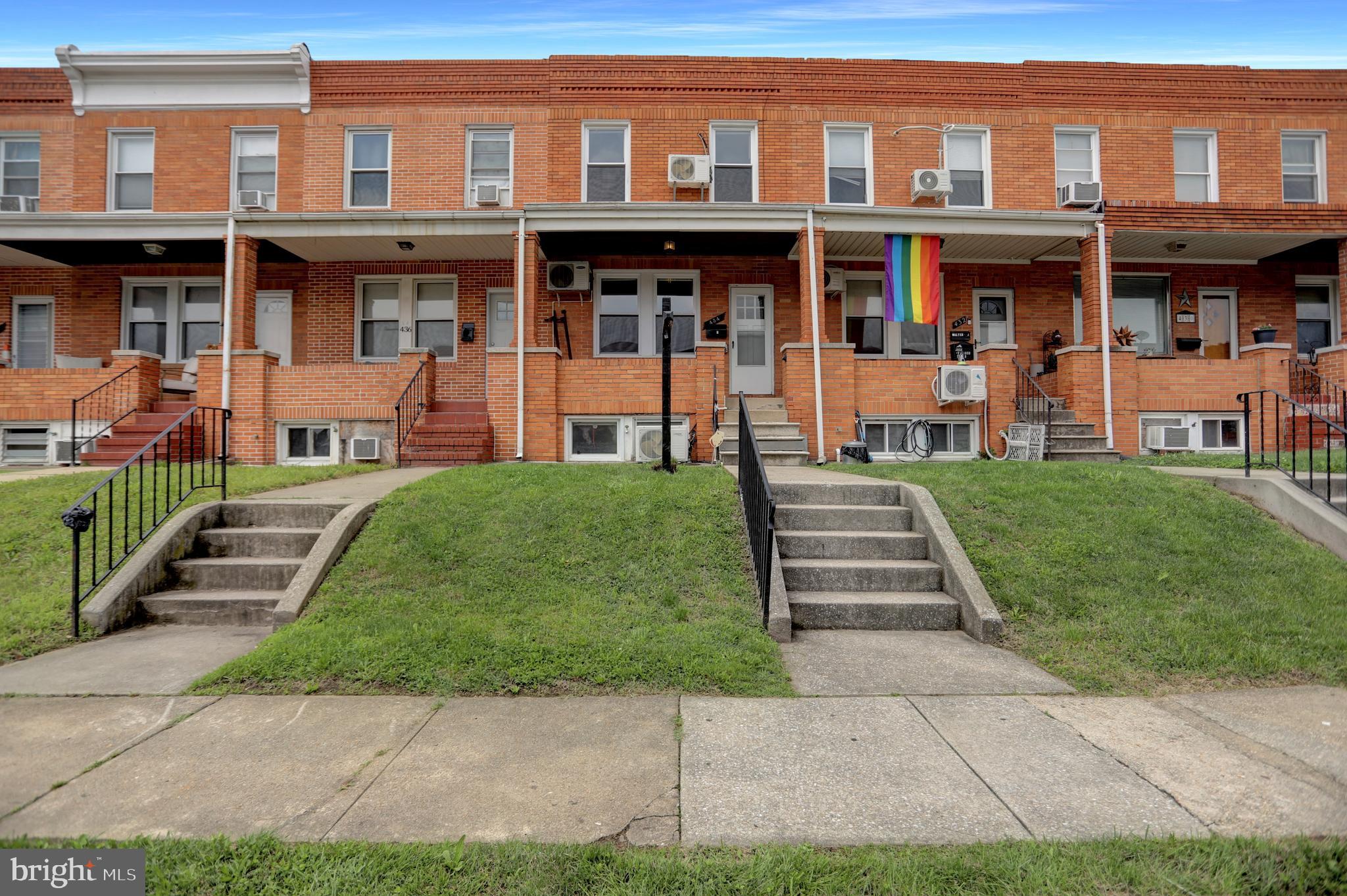 434 Folcroft Street, Unit A Baltimore, MD 21224 - Photo 1 of 22 a front view of a residential apartment building with a yard