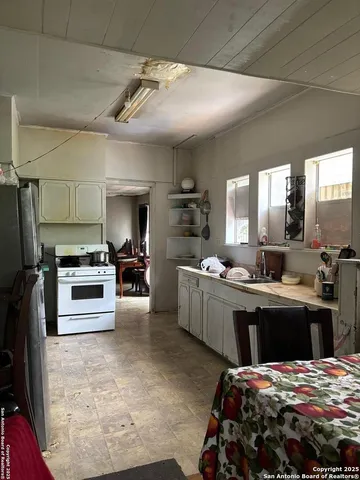 a kitchen with a sink and stainless steel appliances