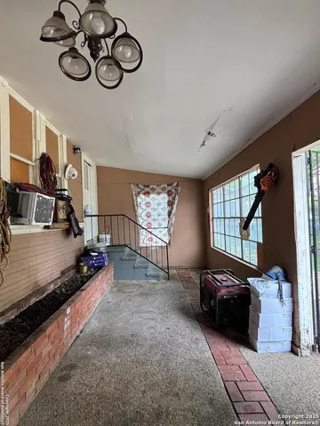 a bedroom with furniture and a window