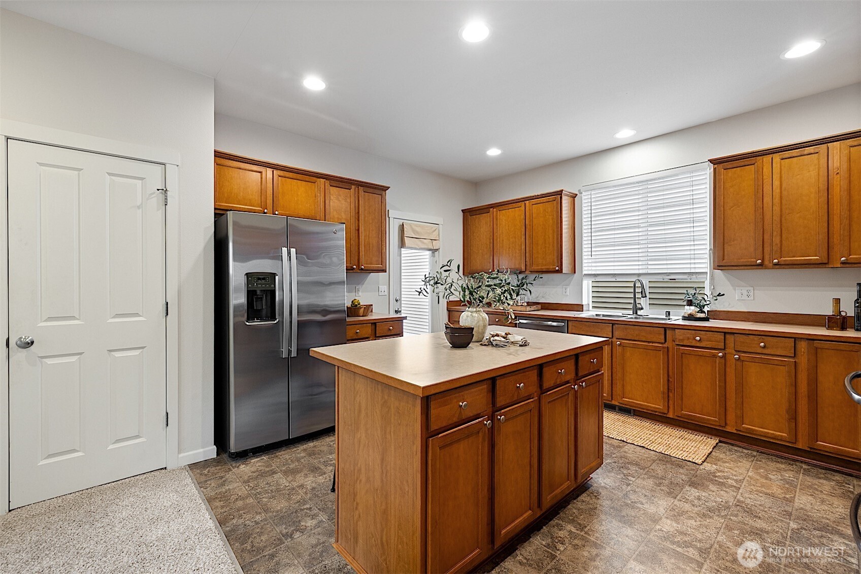 21509 48th Court South, Unit 181 Kent, WA 98032 - Photo 11 of 40 a kitchen with a sink stove and refrigerator