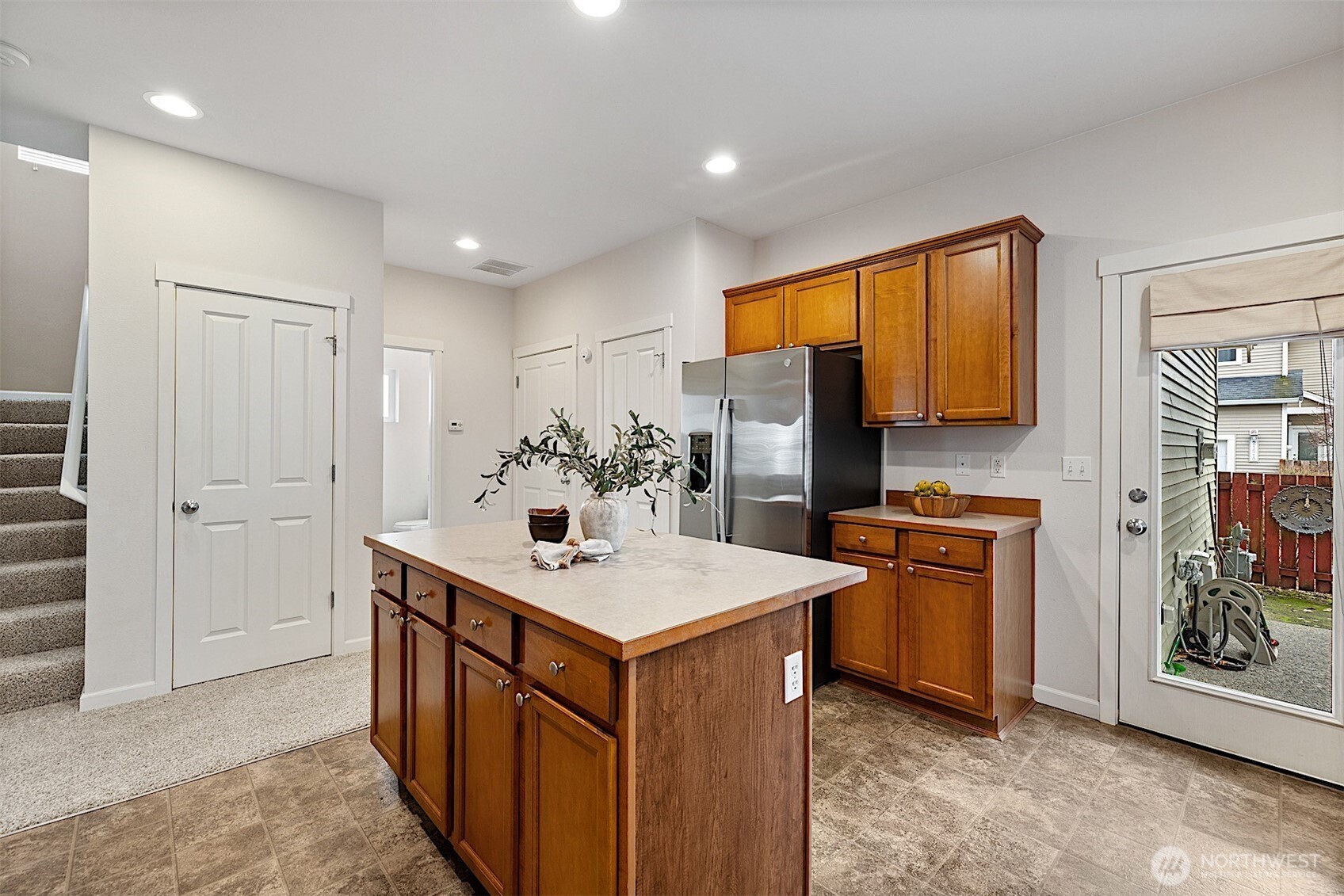 21509 48th Court South, Unit 181 Kent, WA 98032 - Photo 15 of 40 a kitchen with stainless steel appliances granite countertop a sink stove and refrigerator