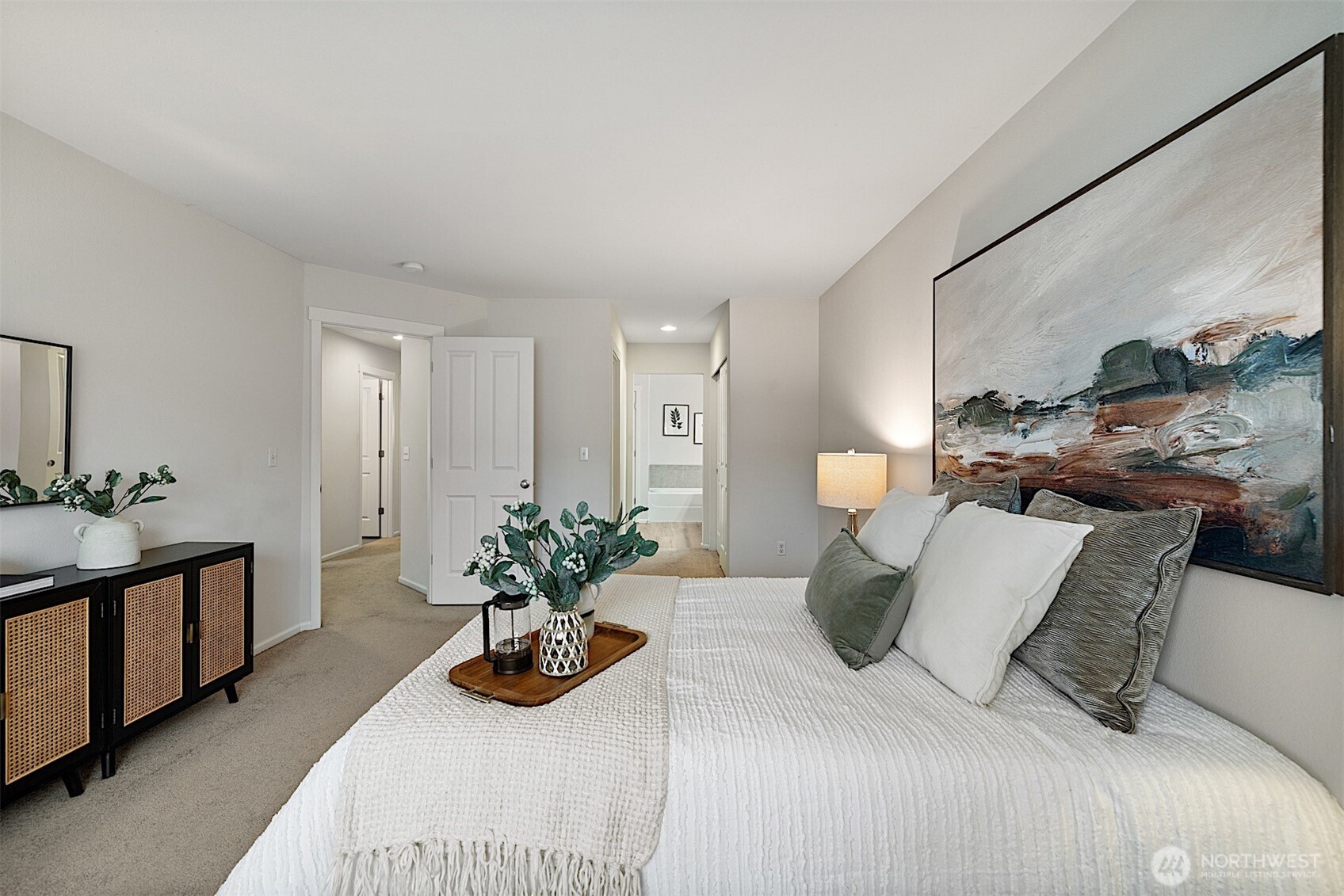 21509 48th Court South, Unit 181 Kent, WA 98032 - Photo 21 of 40 a bedroom with furniture and a potted plant