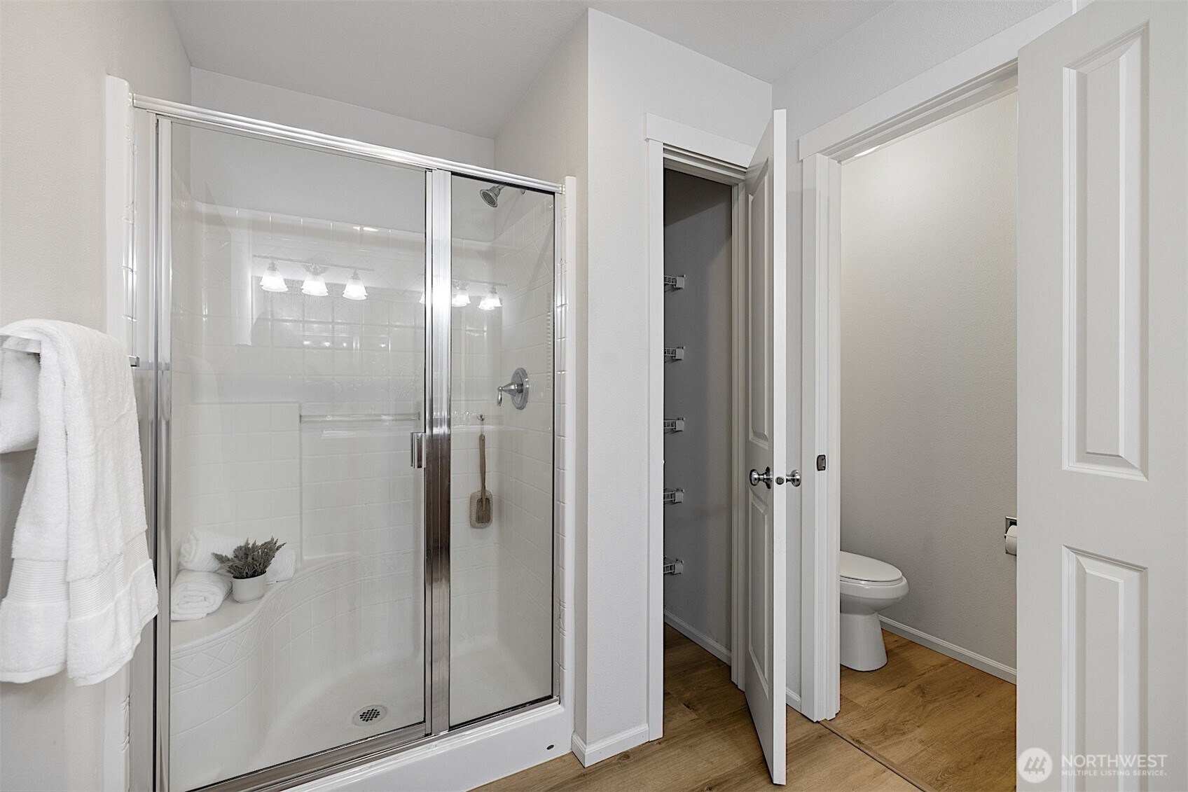 21509 48th Court South, Unit 181 Kent, WA 98032 - Photo 24 of 40 a bathroom with a glass shower door