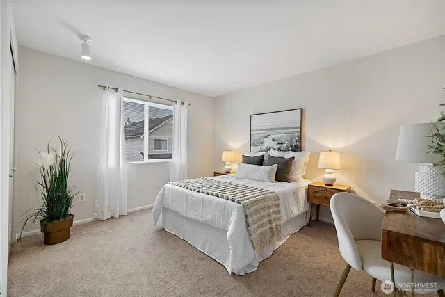 a bedroom with a bed and a couch