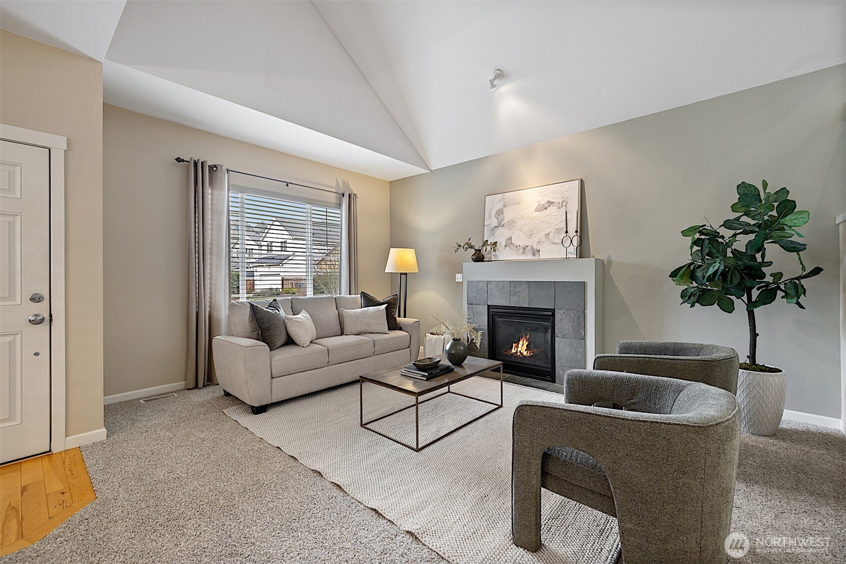 21509 48th Court South, Unit 181 Kent, WA 98032 - Photo 3 of 40 a living room with furniture a fireplace and potted plants