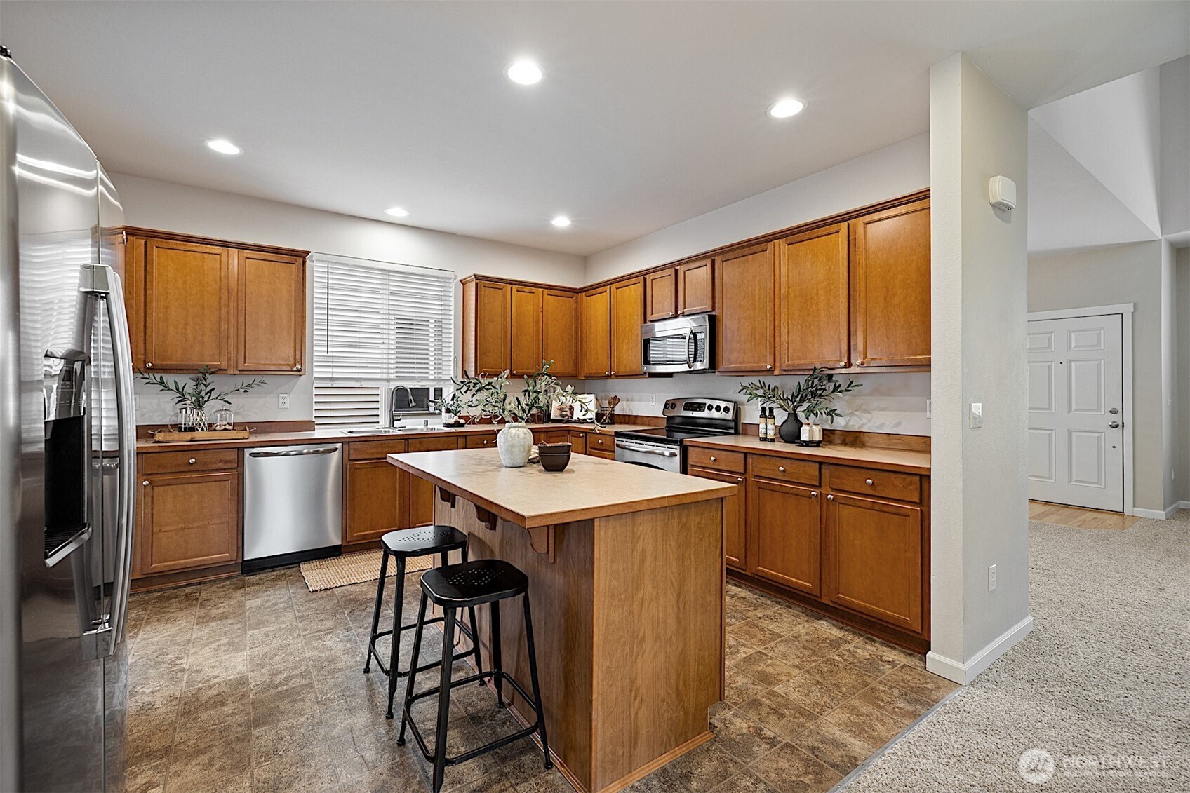21509 48th Court South, Unit 181 Kent, WA 98032 - Photo 10 of 40 a kitchen with a sink a counter top space appliances and cabinets