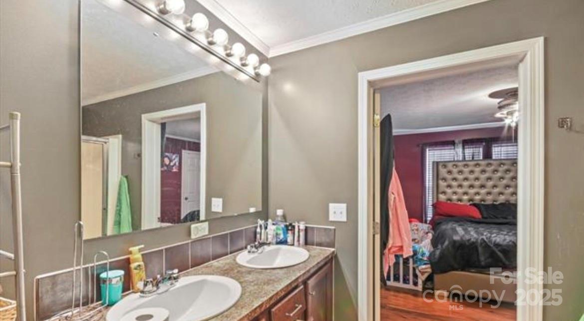 116 Kings Glen Road Old Fort, NC 28762 - Photo 11 of 16 a en suite bathroom with a sink a mirror and a shower