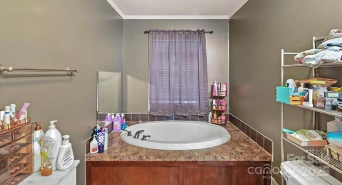 116 Kings Glen Road Old Fort, NC 28762 - Photo 12 of 16 a bathroom with a granite countertop tub and a sink