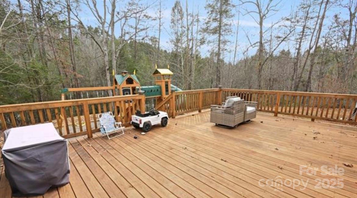 116 Kings Glen Road Old Fort, NC 28762 - Photo 2 of 16 a view of a deck with couches and wooden floor