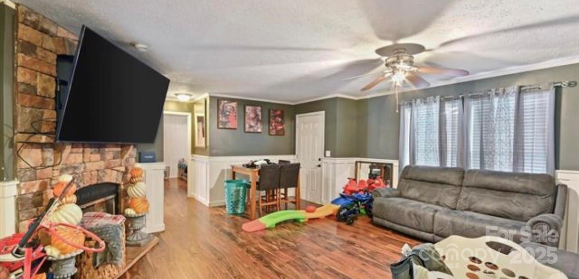 116 Kings Glen Road Old Fort, NC 28762 - Photo 6 of 16 a living room with furniture and a flat screen tv