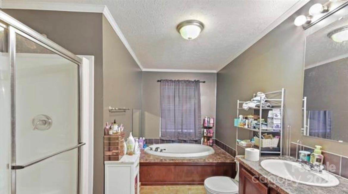 116 Kings Glen Road Old Fort, NC 28762 - Photo 10 of 16 a bathroom with a granite countertop sink and a mirror