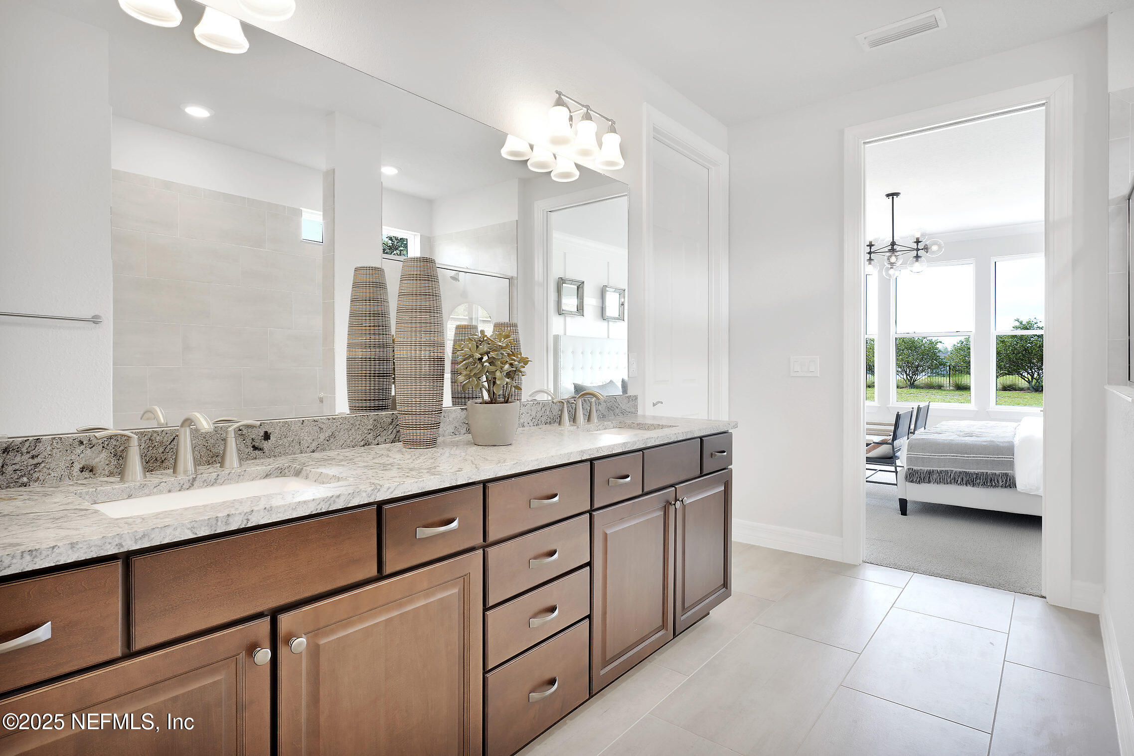 334 Continuum Loop Yulee, FL 32097 - Photo 11 of 37 a spacious bathroom with a granite countertop sink a toilet a large mirror and shower
