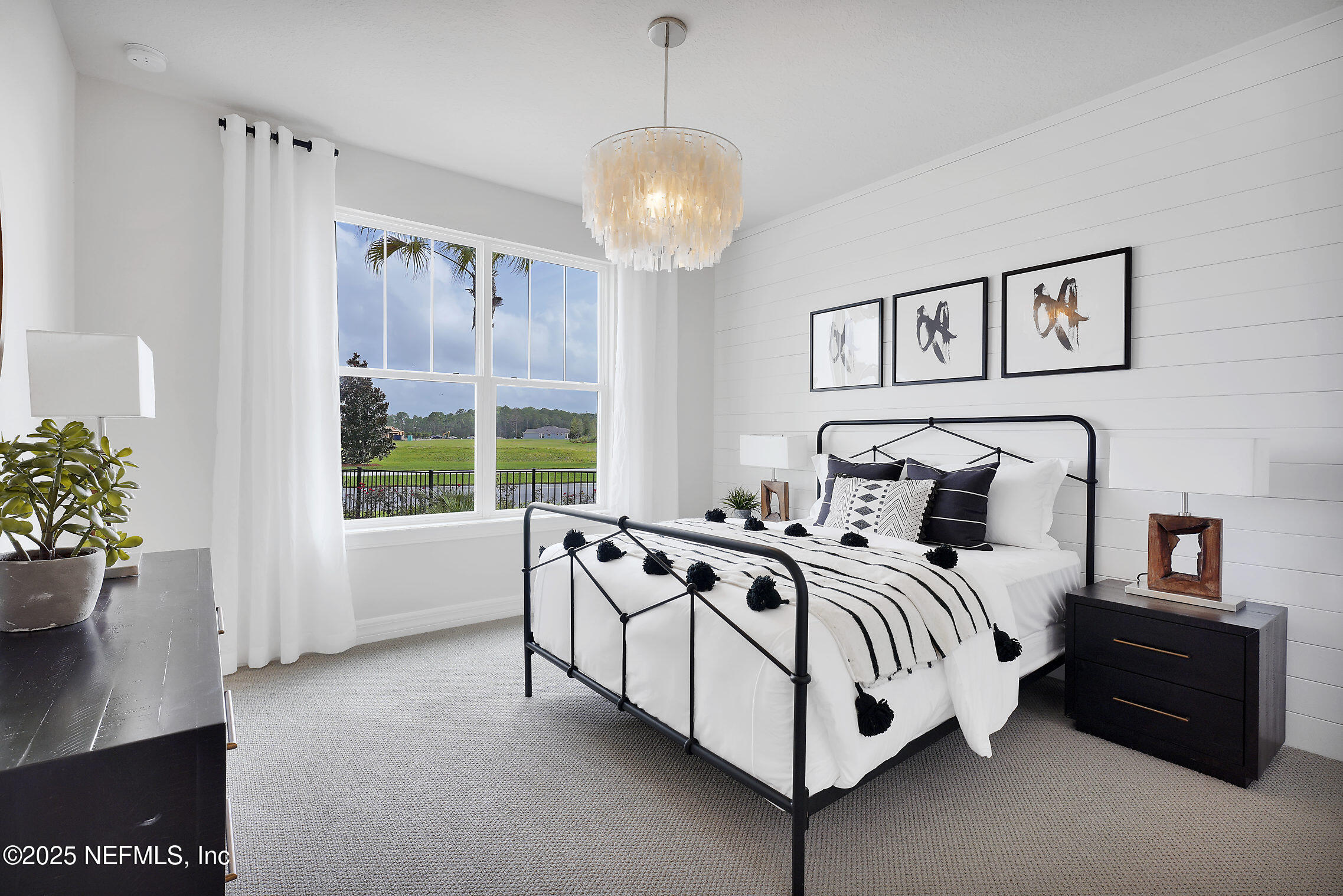 334 Continuum Loop Yulee, FL 32097 - Photo 12 of 37 a bedroom with a bed and a window