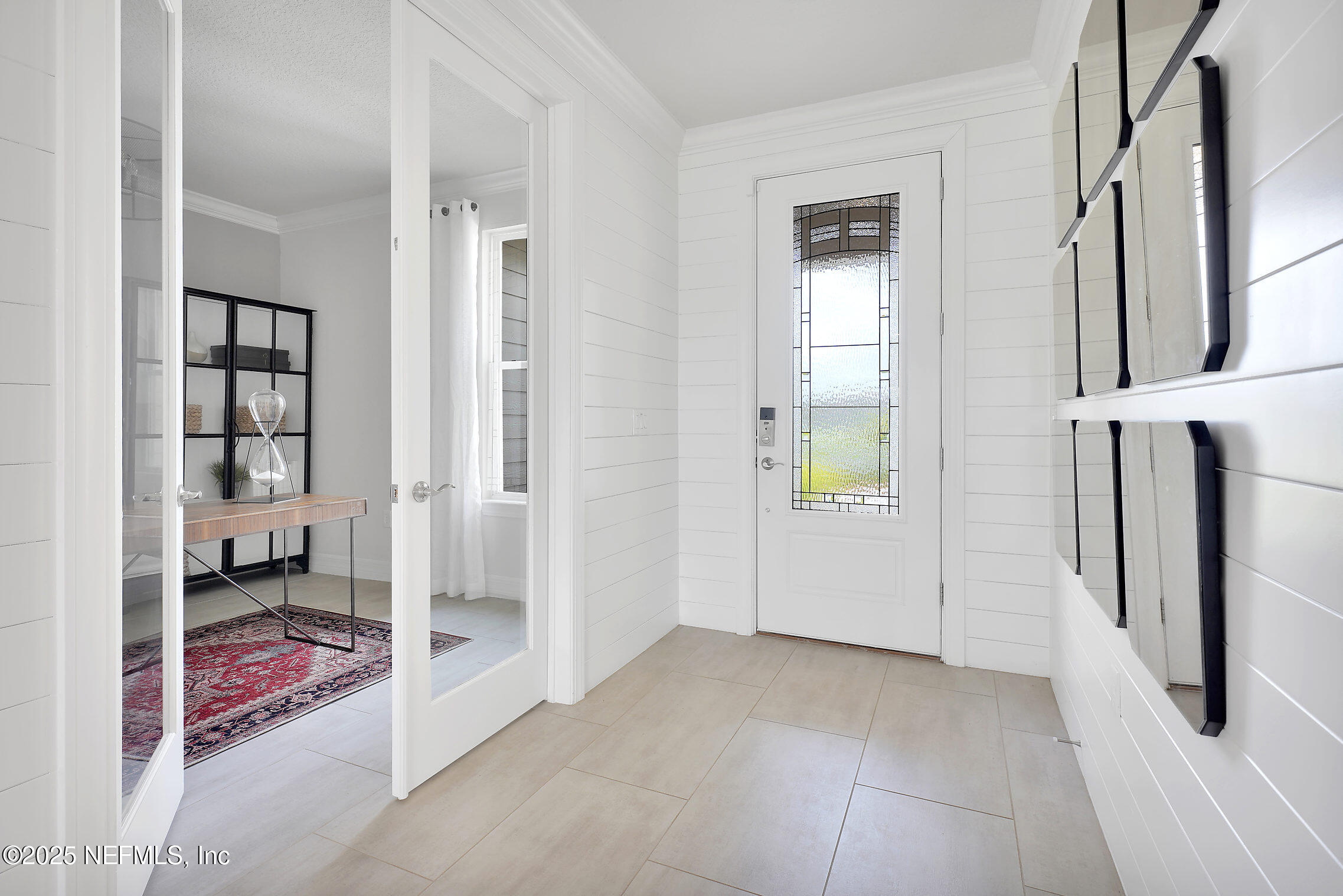 334 Continuum Loop Yulee, FL 32097 - Photo 3 of 37 a view of a livingroom with wooden floor and a bedroom