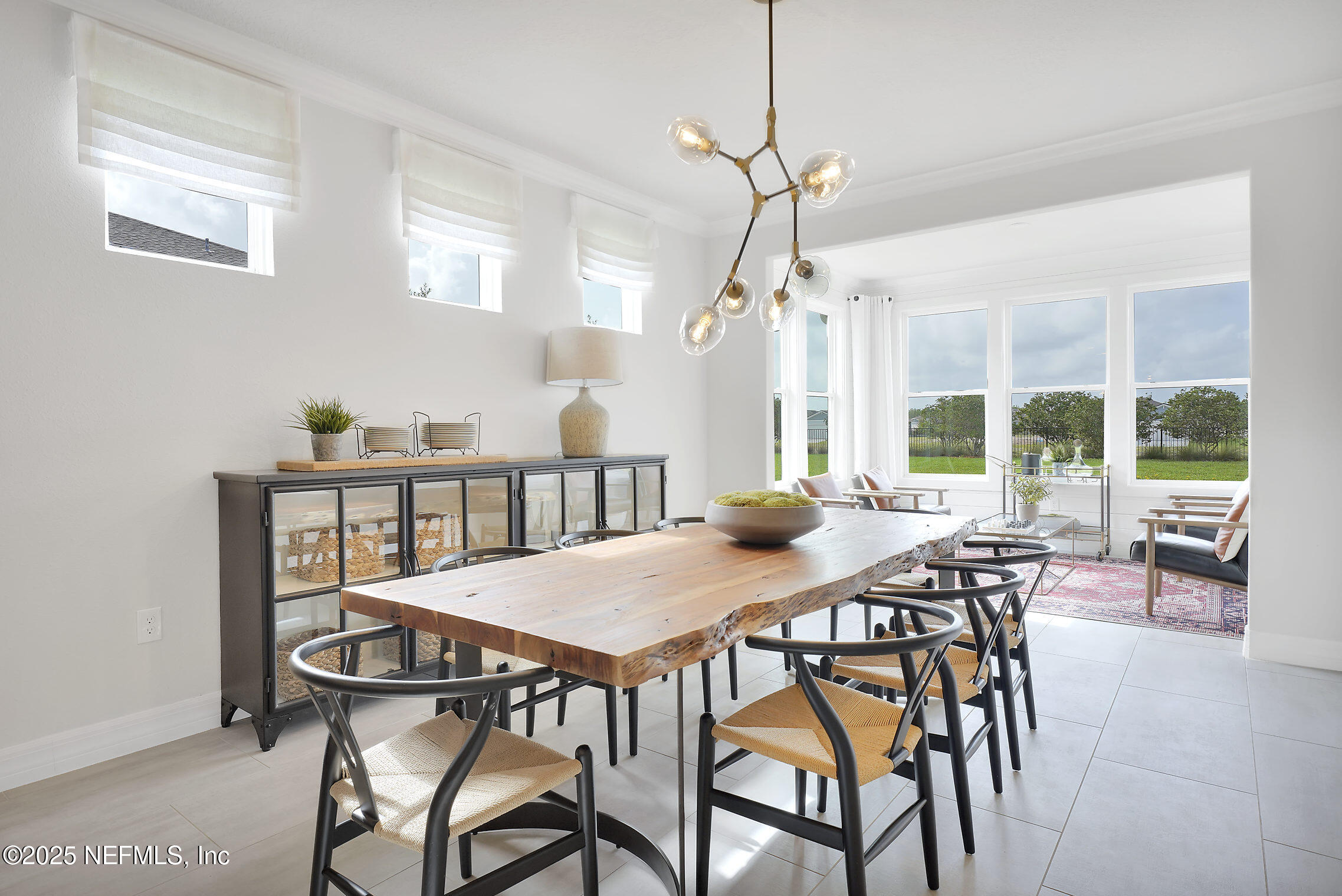 334 Continuum Loop Yulee, FL 32097 - Photo 7 of 37 a view of a dining room with furniture window and outside view