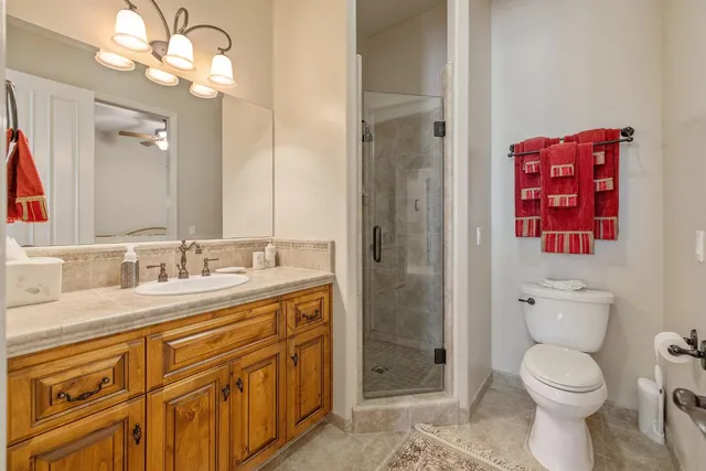 a kitchen with stainless steel appliances granite countertop a stove a sink a oven a dining table and chairs