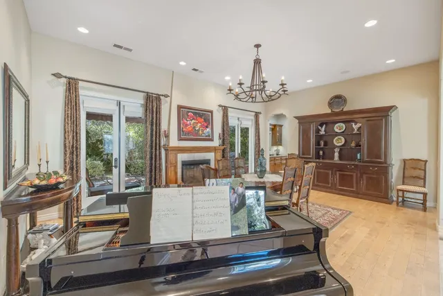 a kitchen with stainless steel appliances kitchen island granite countertop a stove and a microwave