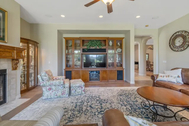 a view of a dining room with furniture large windows and wooden floor