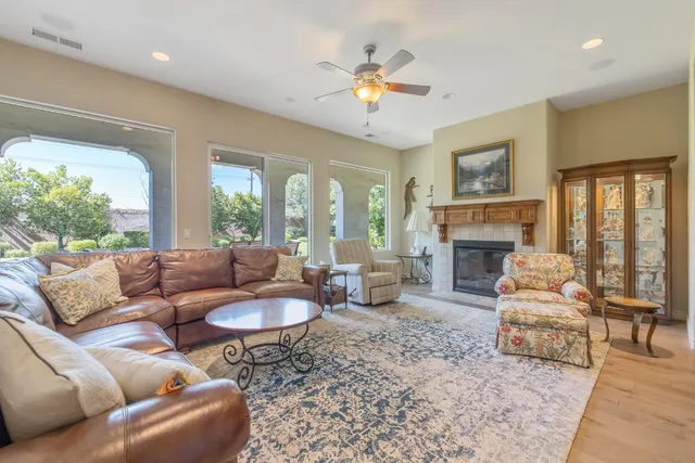 a bathroom with a granite countertop sink a mirror and a shower