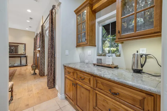 an aerial view of house with yard swimming pool and mountains