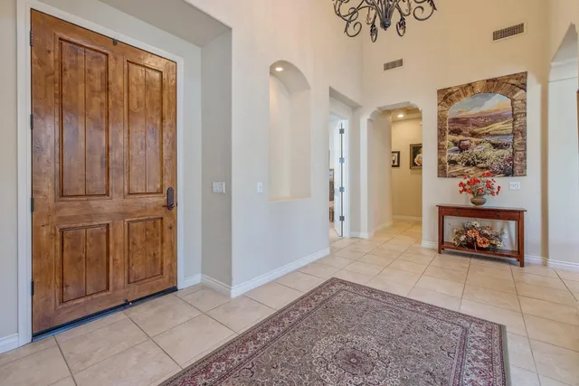 a view of a hallway with potted plants