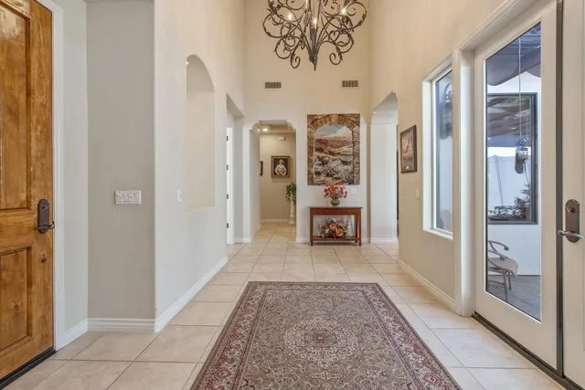 a bathroom with a granite countertop toilet sink and mirror
