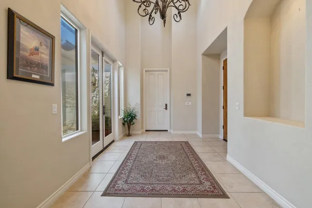 a view of a hallway with closet and a potted plant