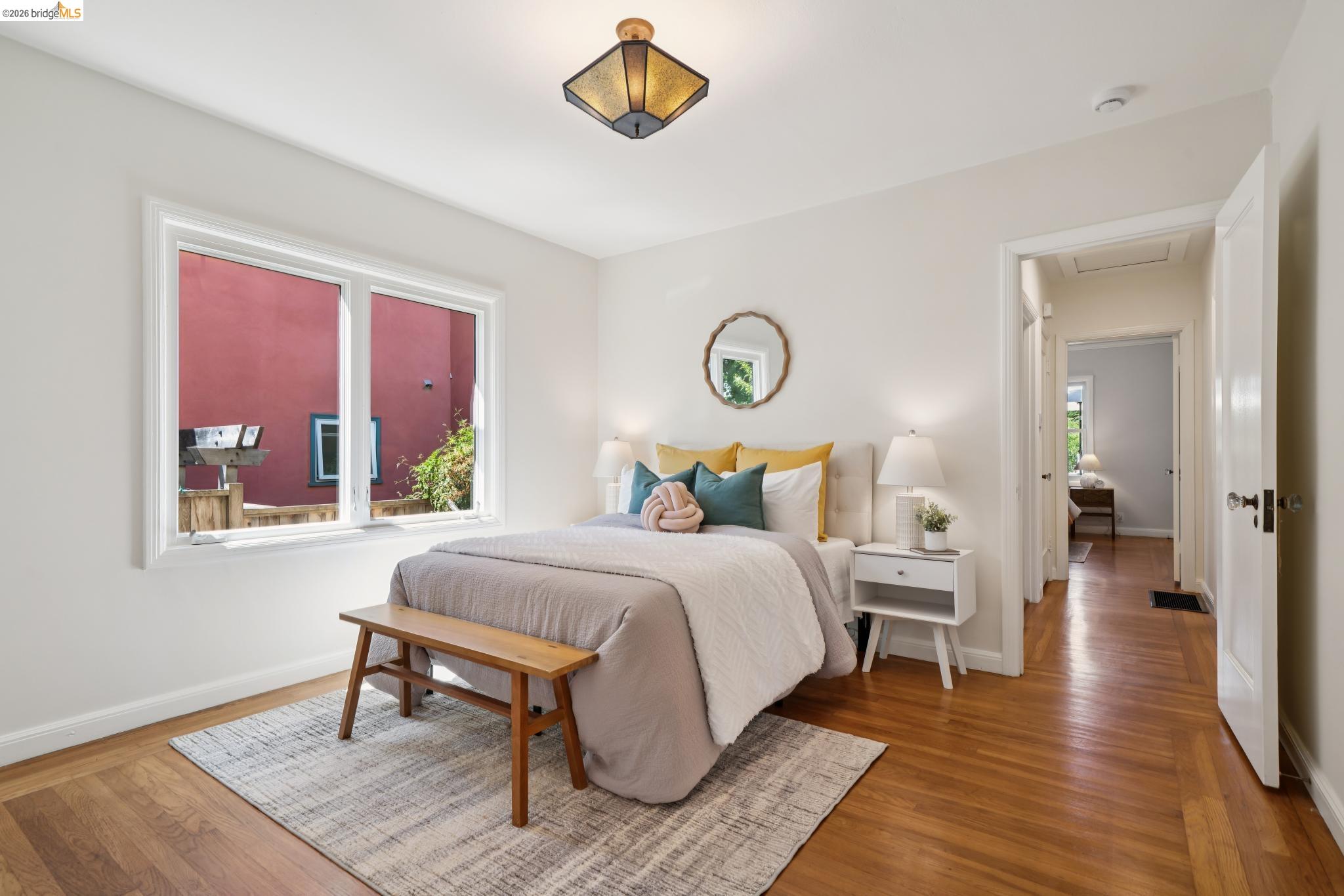 1425 Virginia Street Berkeley, CA 94702 - Photo 21 of 42 a bedroom with a bed and wooden floor