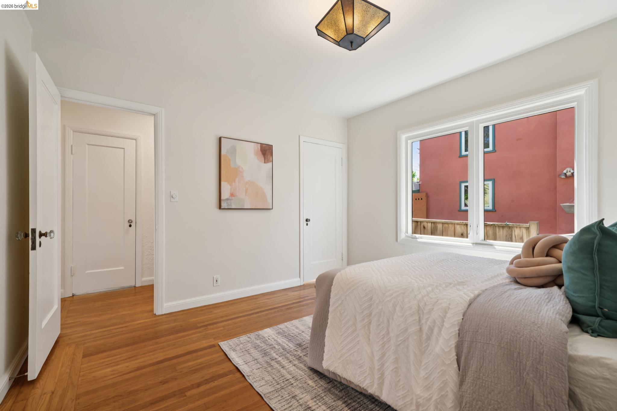 1425 Virginia Street Berkeley, CA 94702 - Photo 22 of 42 a bedroom with a bed and a window