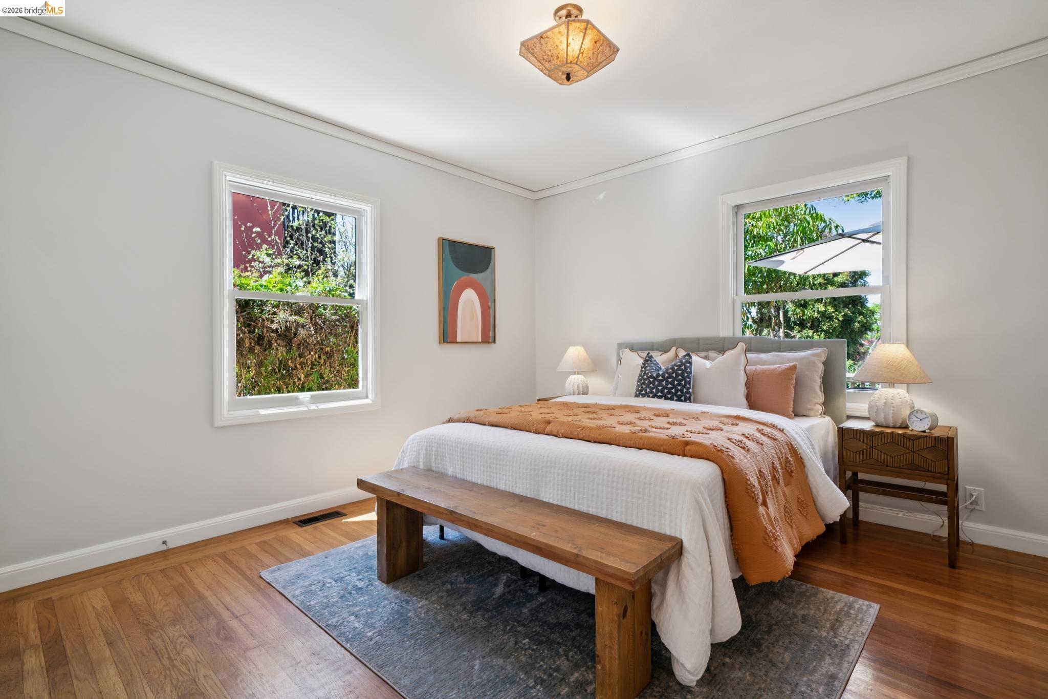 1425 Virginia Street Berkeley, CA 94702 - Photo 25 of 42 a bedroom with a bed wall painting and window
