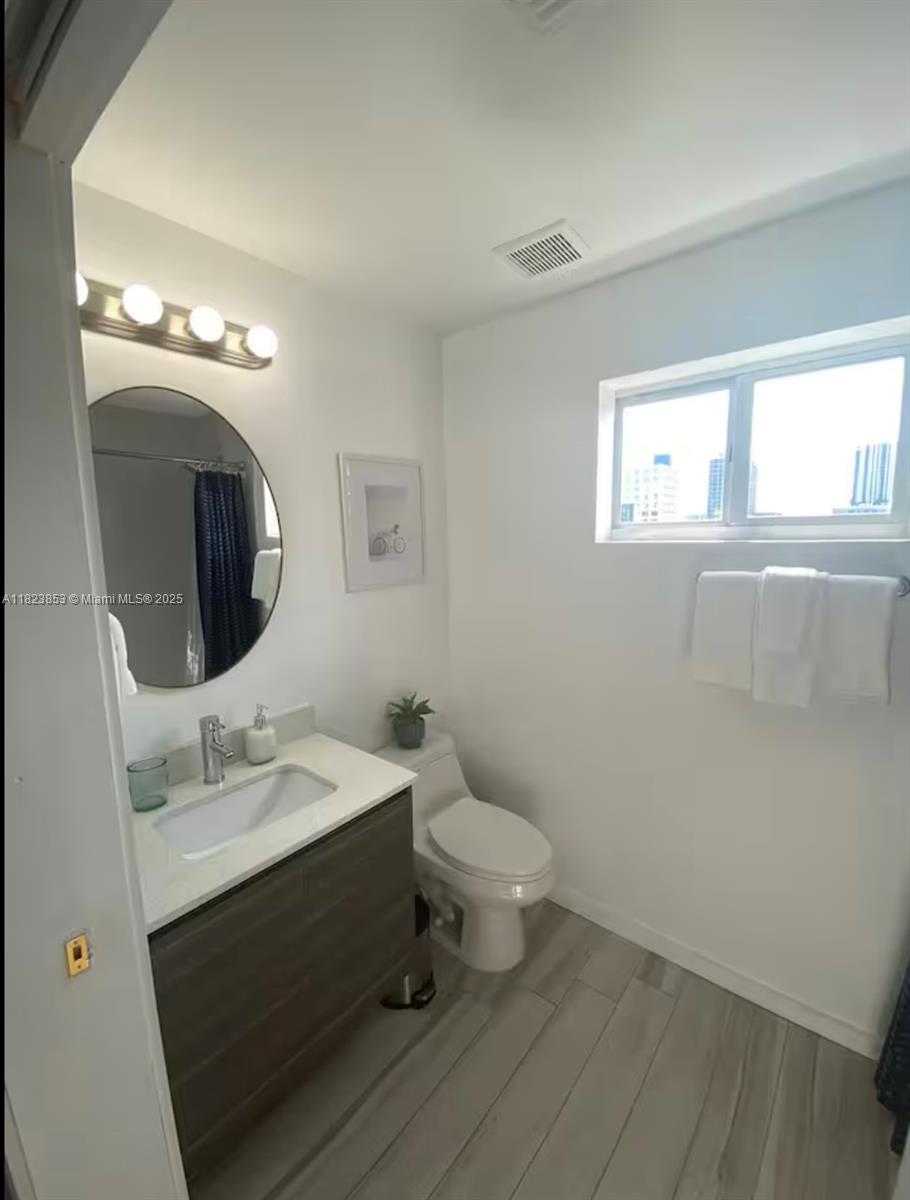 481 Northeast 29th Street, Unit 706 Miami, FL 33137 - Photo 26 of 26 a bathroom with a sink and a mirror