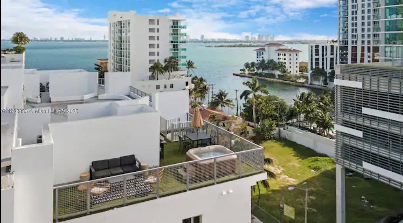 481 Northeast 29th Street, Unit 706 Miami, FL 33137 - Photo 5 of 26 a view of a lake with tall buildings