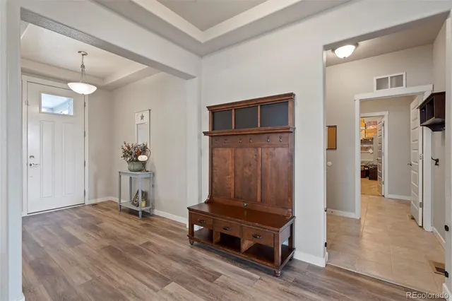 a view of a livingroom with furniture and wooden floor