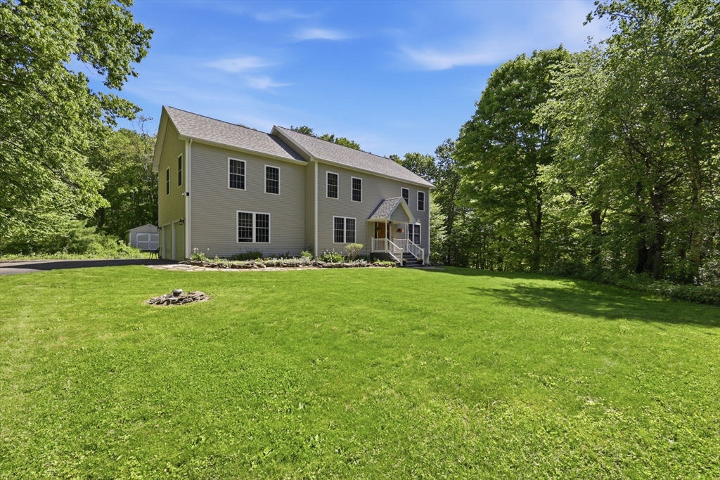 345 Bragg Road Warren, MA 01585 - Photo 2 of 41 a front view of house with yard
